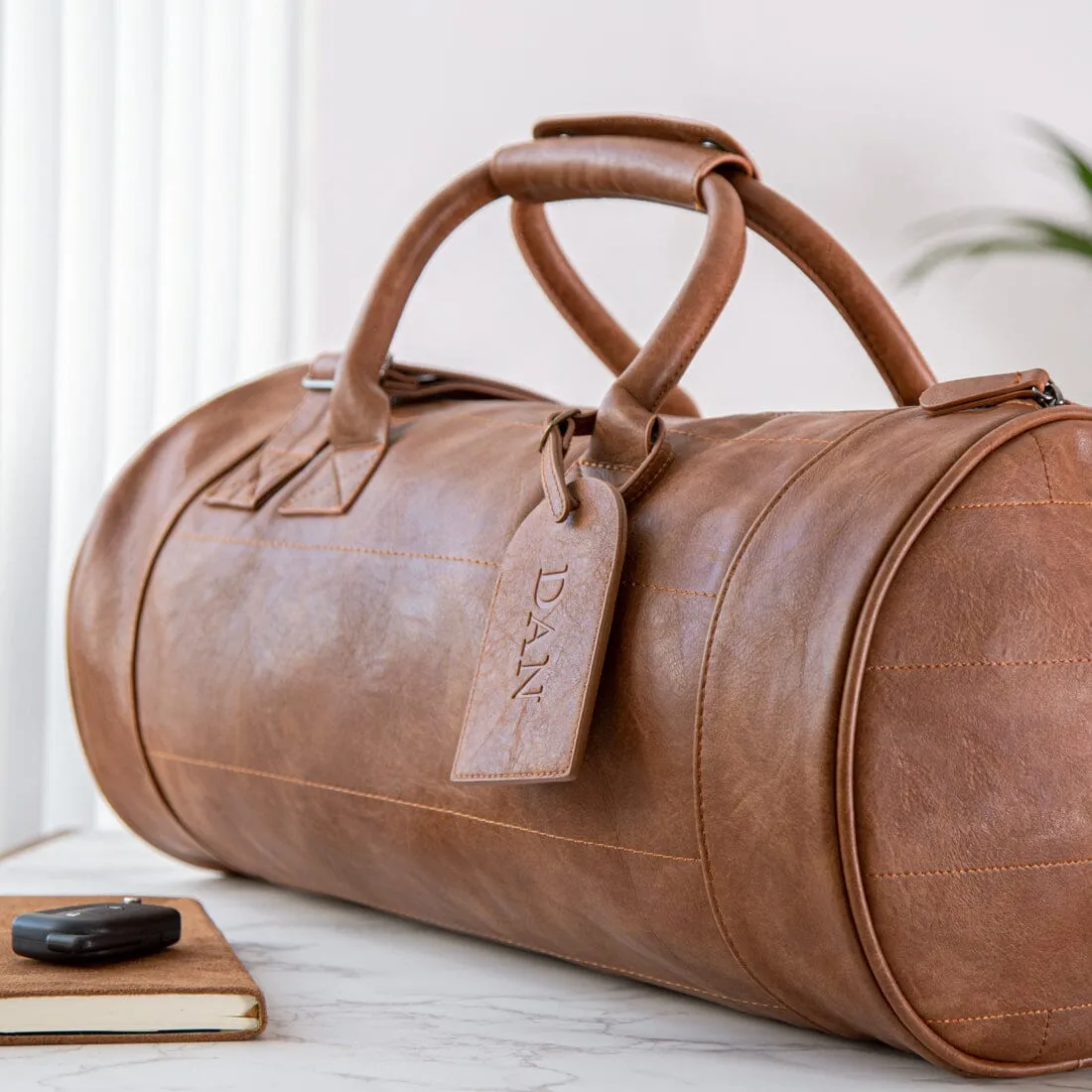 Faux Leather Barrel Bag With Personalised Luggage Tag